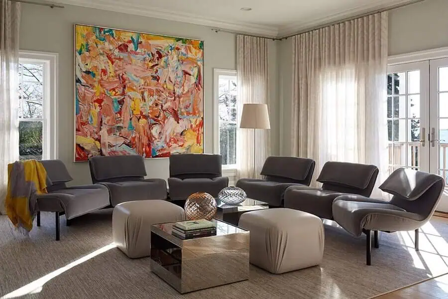 1960s-inspired living room with modern lounge chairs, abstract artwork, and a chic retro aesthetic.