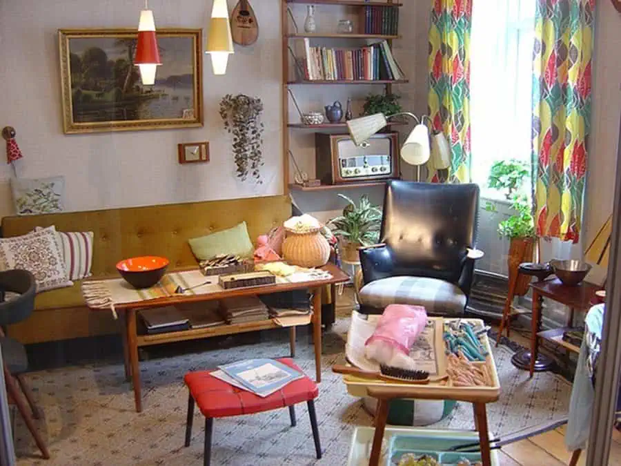 1960s Scandinavian living room with vintage furniture, colorful curtains, and mid-century decor.