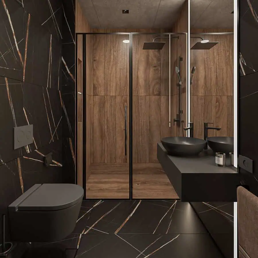 Modern black and wood bathroom with a glass shower, floating vanity, and sleek vessel sinks.