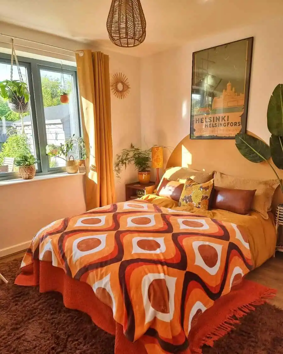 Retro-inspired bedroom with bold orange bedding, warm lighting, natural textures, and cozy decor.