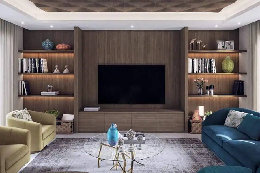 Modern carpeted living room with built-in shelving, a glass coffee table, and cozy seating.