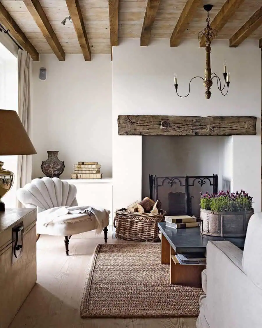 Rustic carpeted living room with exposed wood beams, a cozy fireplace, and vintage decor.