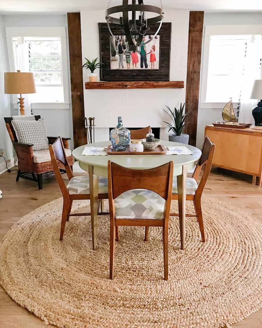 Dining room harmonizing finishes with vintage wood chairs, a round woven rug, and rustic accents.