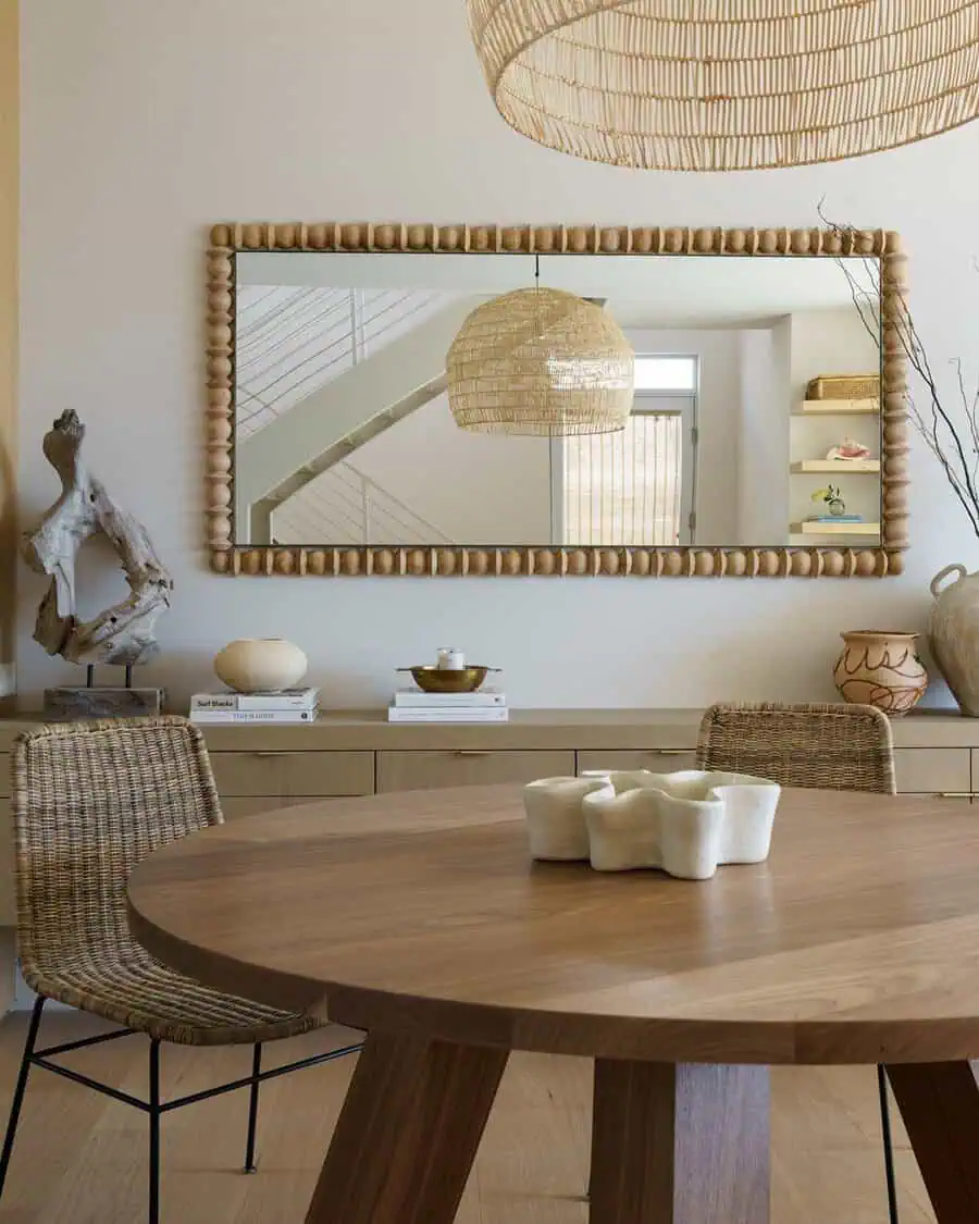 Dining room with mixed wood tones, woven textures, and layered depth for a warm, organic feel.