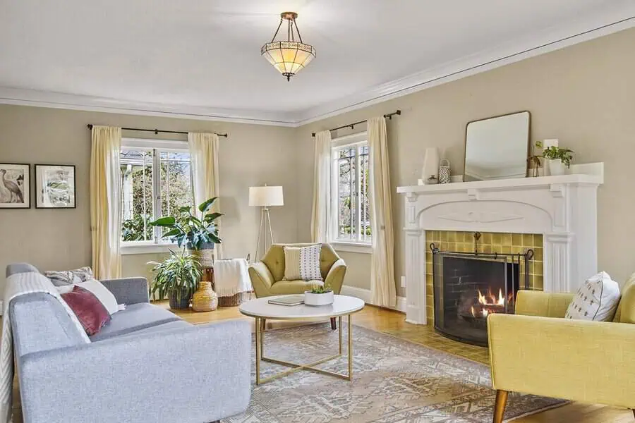 Dutch Colonial living room with a warm neutral color palette, cozy fireplace, and elegant decor.