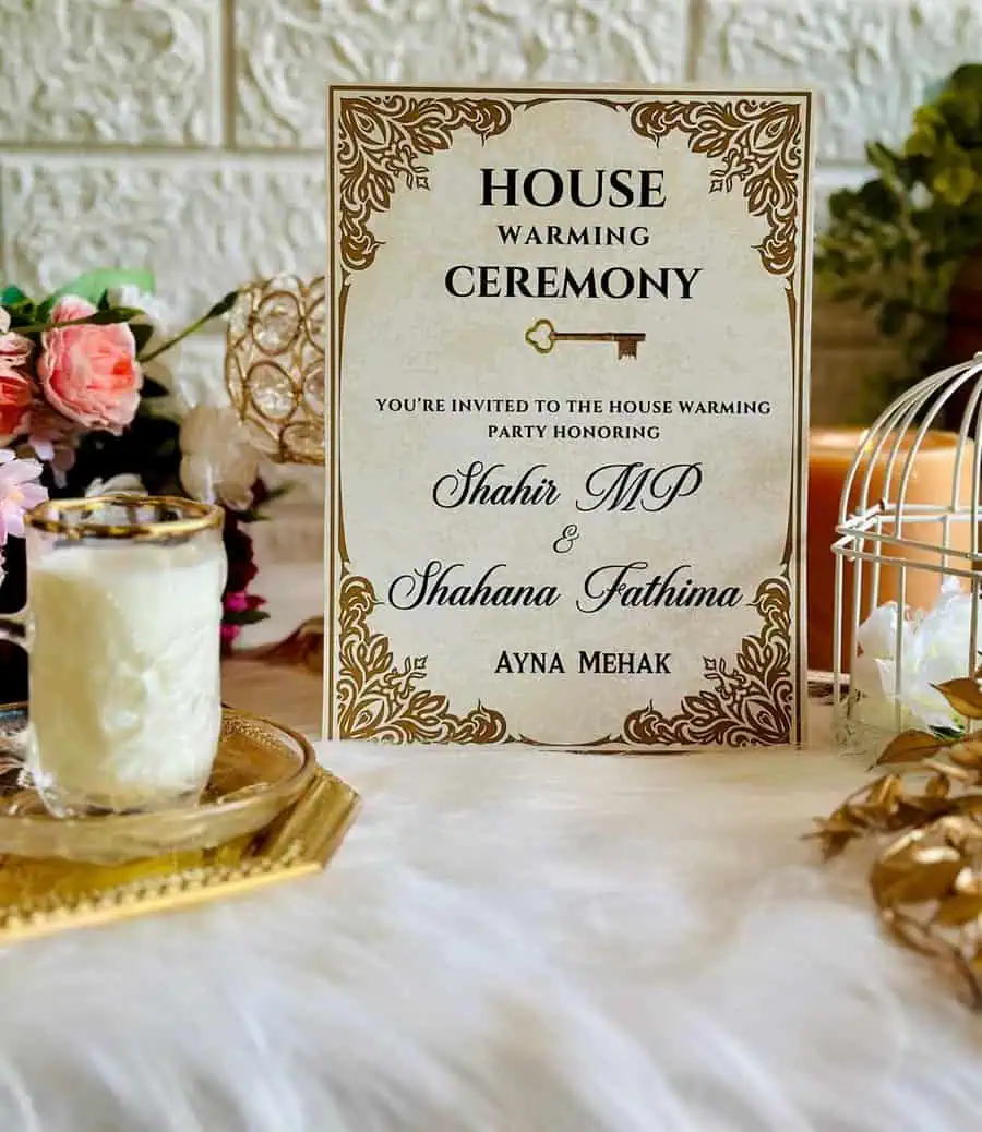 Elegant personalized housewarming invitation with gold accents, floral decor, and a vintage aesthetic.