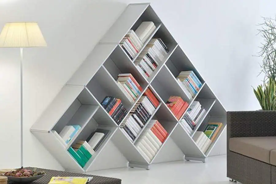 Modern living room with geometric bookshelf design, sleek storage, and a minimalist aesthetic.