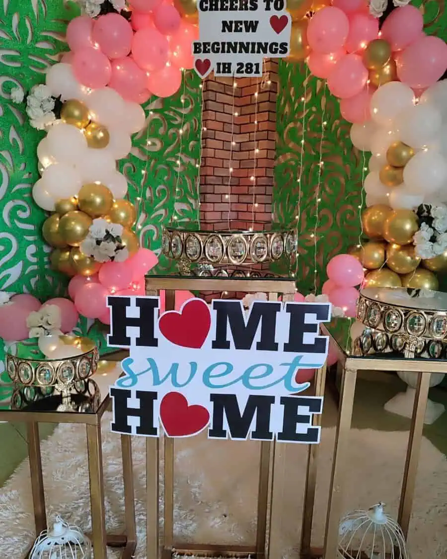 Kid-friendly housewarming party with a colorful "Home Sweet Home" sign, balloons, and playful decor.