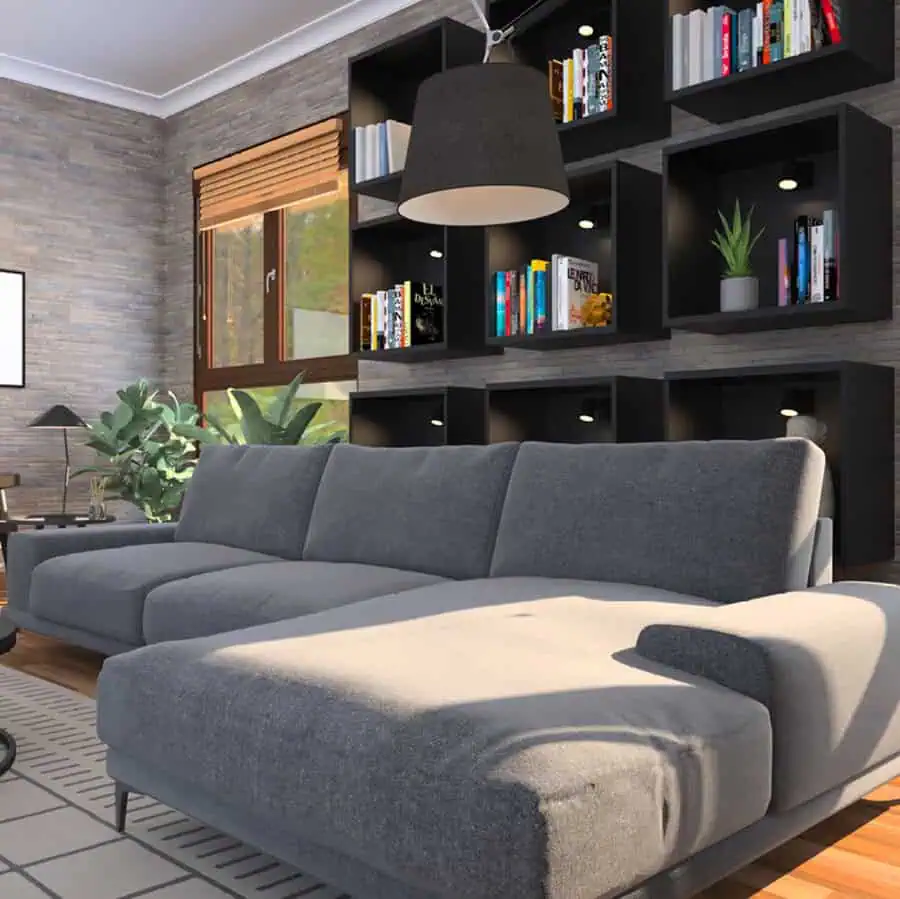 Modern living room with wall-mounted bookshelves, integrated lighting, and a cozy gray sectional sofa.