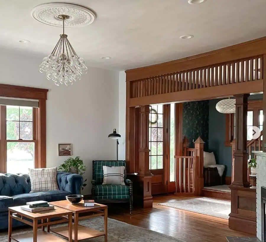 Living room with honey tones, cozy interiors, rich wood details, and mixed wood tones for warmth.