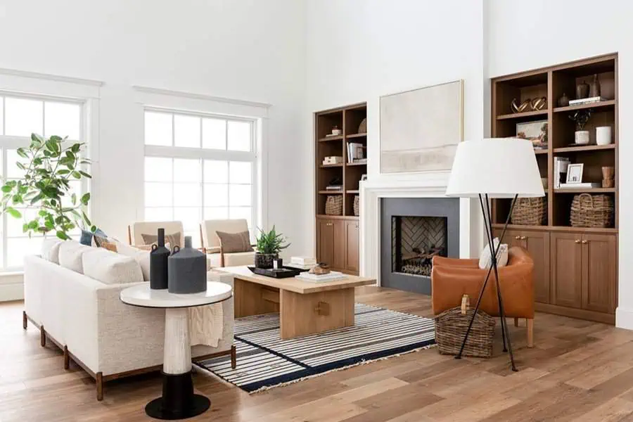 Living room with oak and walnut flooring, warm wood accents, and a cozy modern design.