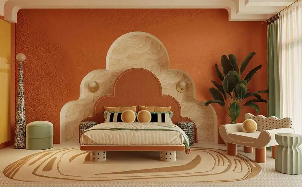 Luxurious bedroom with an orange accent wall, sculptural headboard, bold decor, and soft lighting.