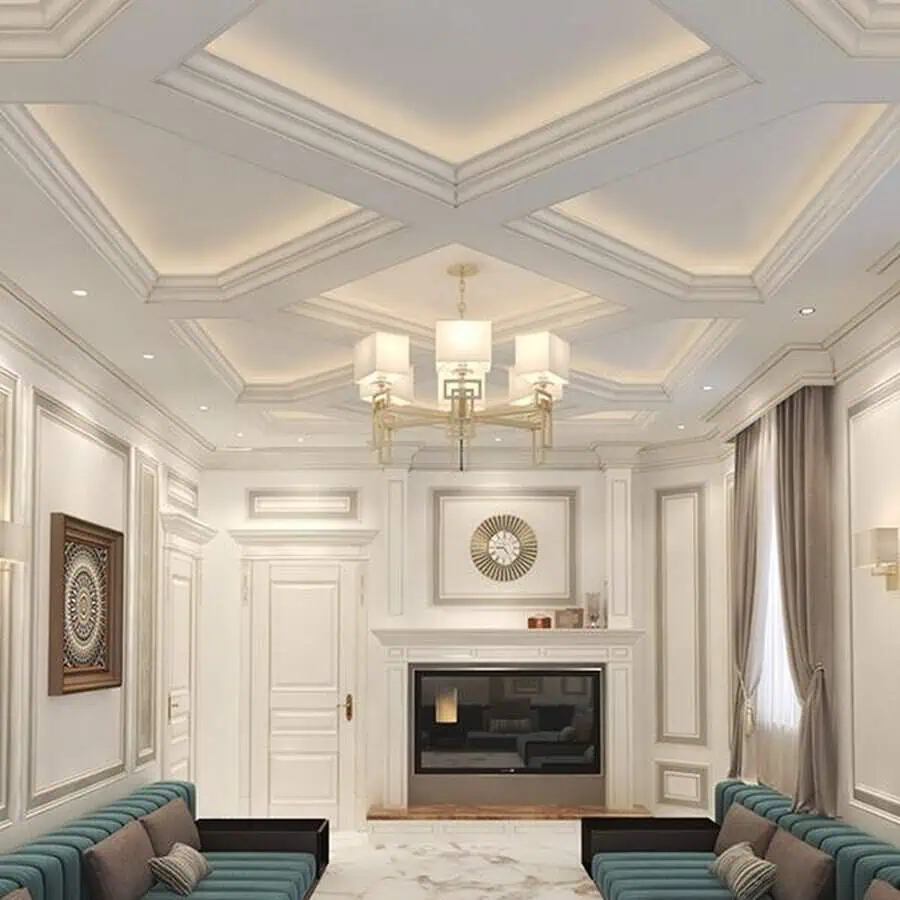 Luxury living room with an elegant coffered ceiling, chandelier, fireplace, and plush seating.