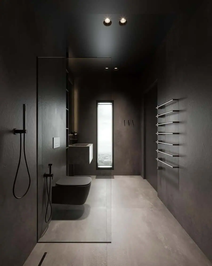 Minimalist black bathroom with a walk-in shower, floating toilet, and sleek modern fixtures.