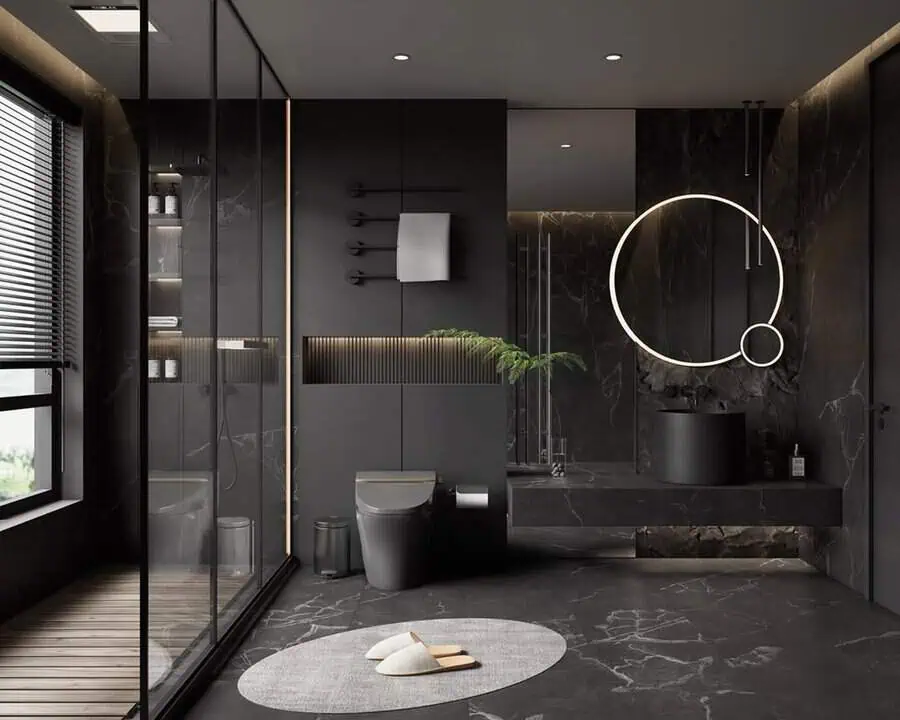 Luxury black bathroom with marble walls, glass shower, and a modern illuminated mirror.