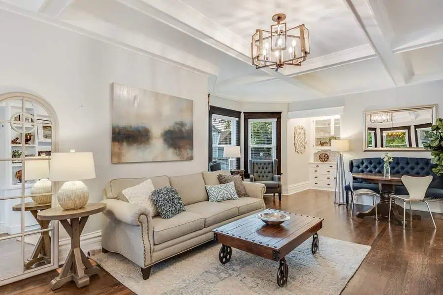 Open-concept living room with a modern coffered ceiling, neutral decor, and a cozy seating area.