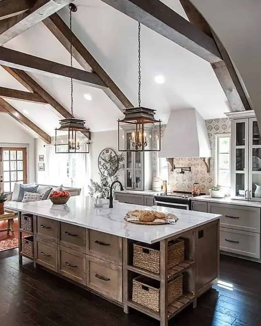 Farmhouse-style open kitchen with rustic beams, large island, and smart storage baskets.