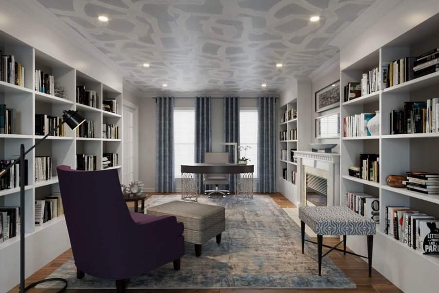 Sophisticated home library with built-in bookshelves, elegant seating, and a modern desk.