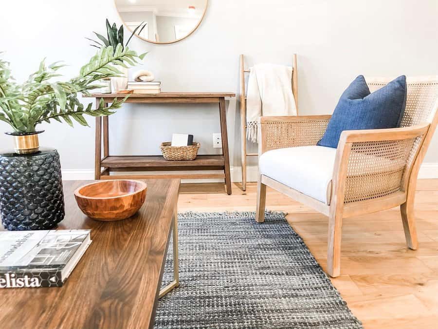 Seamless blend of flooring and furniture with mixed wood tones, woven textures, and soft accents.