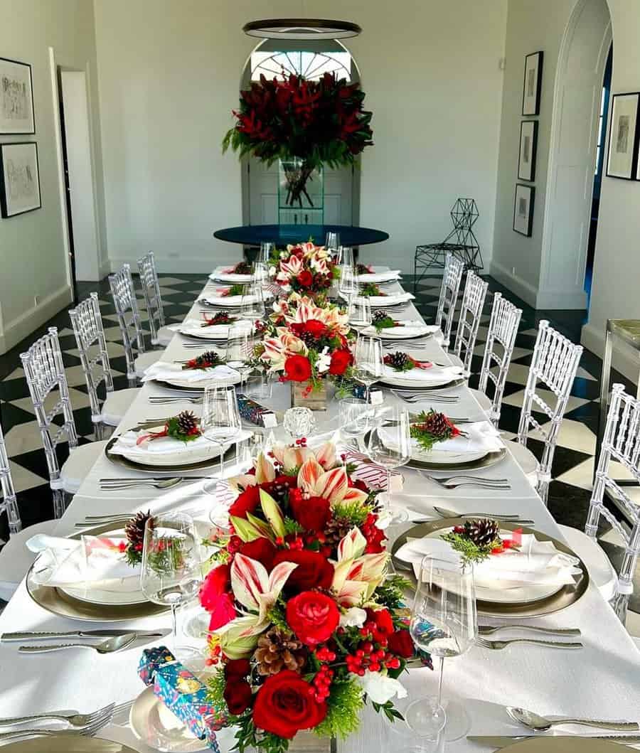 Simple and elegant housewarming party with a beautifully set dining table and red floral decor.