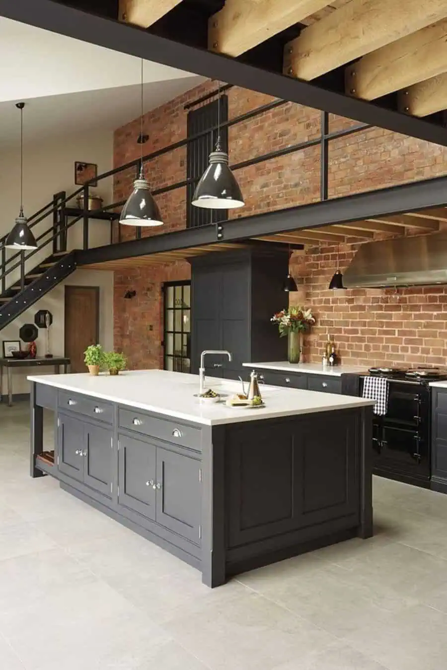 Simple kitchen design with dark cabinetry, exposed brick walls, industrial lighting, and a modern open layout.