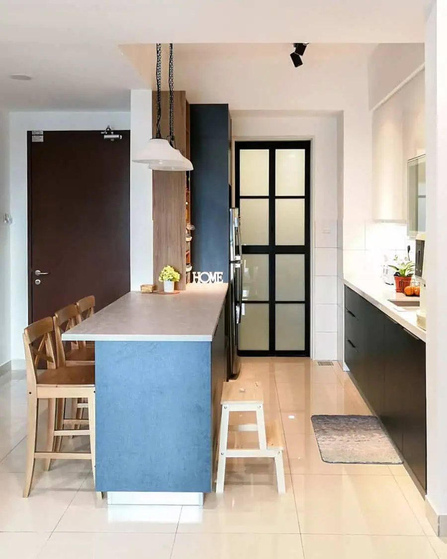 Simple kitchen design with a blue island, black cabinets, and warm wood accents for a unique style.