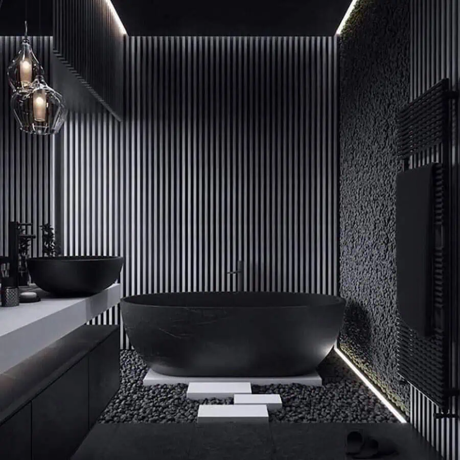 Modern black bathroom with a freestanding tub, textured walls, and ambient lighting.