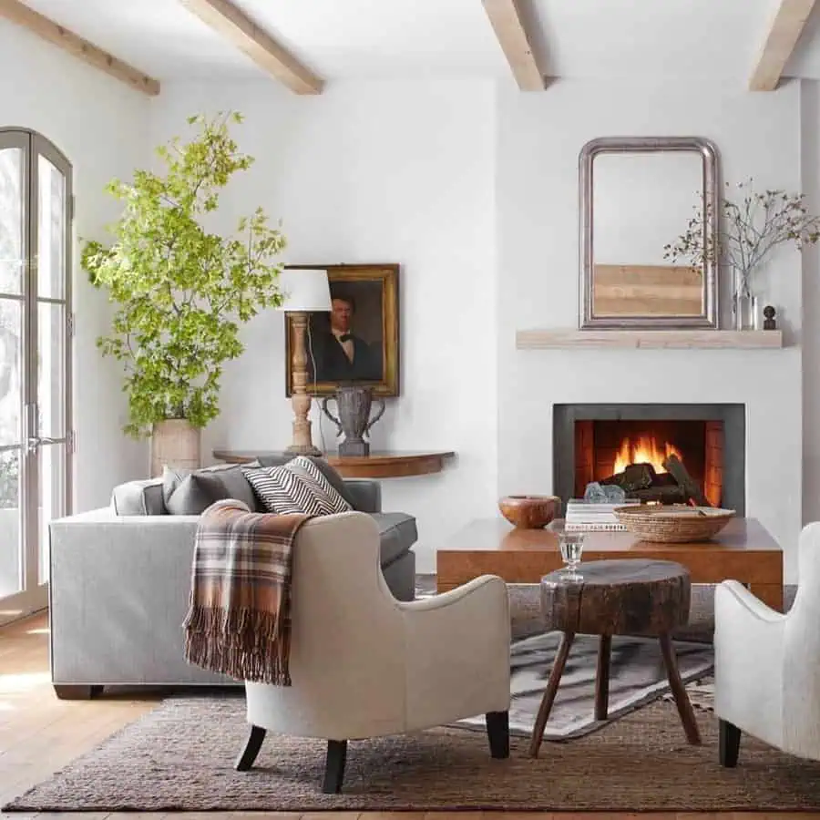 Vintage meets modern with reclaimed wood, mixed wood tones, and a cozy fireplace setting.