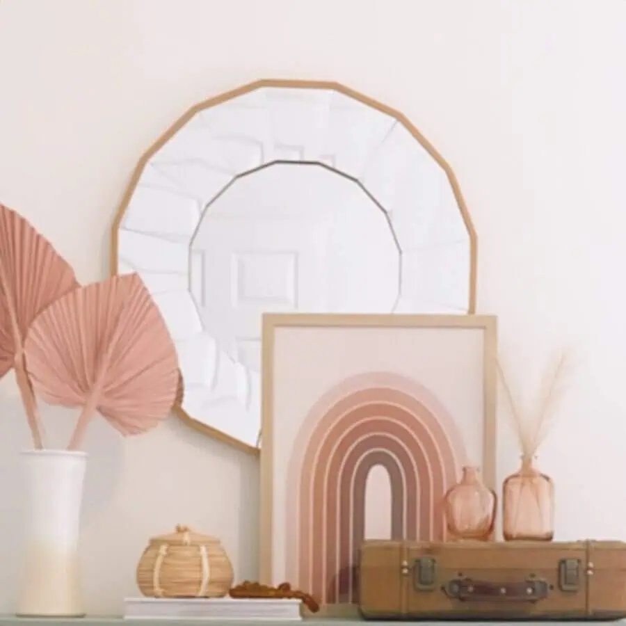 Boho decor with dried palms, earthy artwork, and woven accents in soft pink and neutral tones for a warm, relaxed aesthetic.