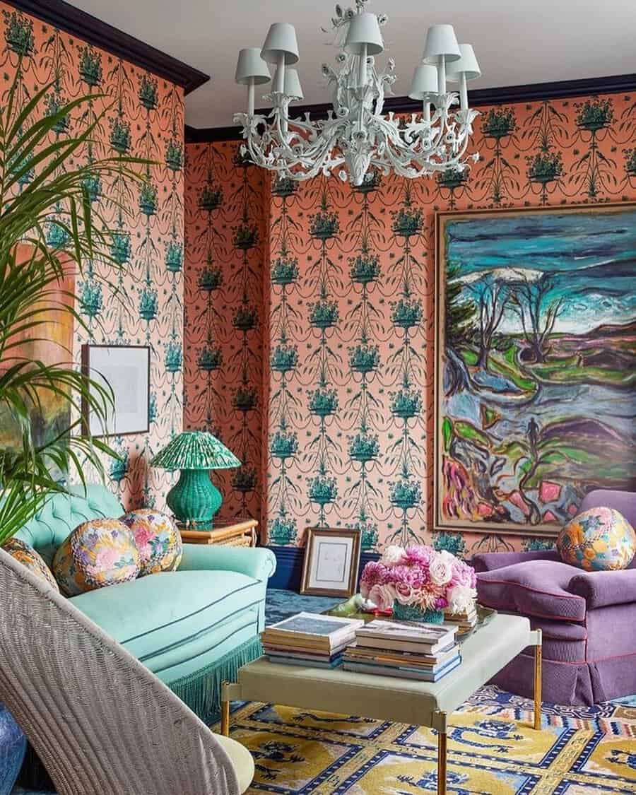 Eclectic bedroom sitting area with bold wallpaper, colorful furniture, vintage accents, layered textiles, and statement lighting.