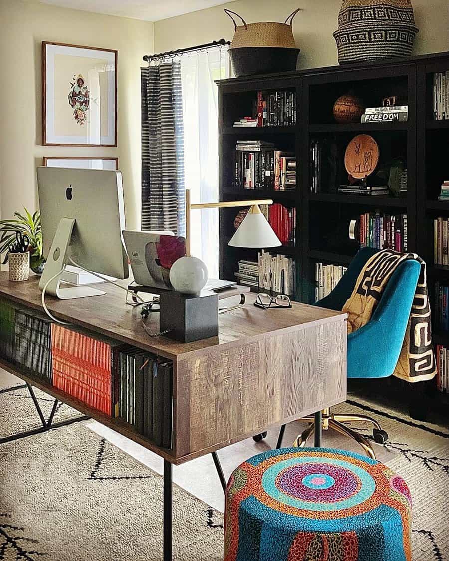 Home office with practical storage options, including colorful stool, open bookshelves, and baskets for an organized, functional space.