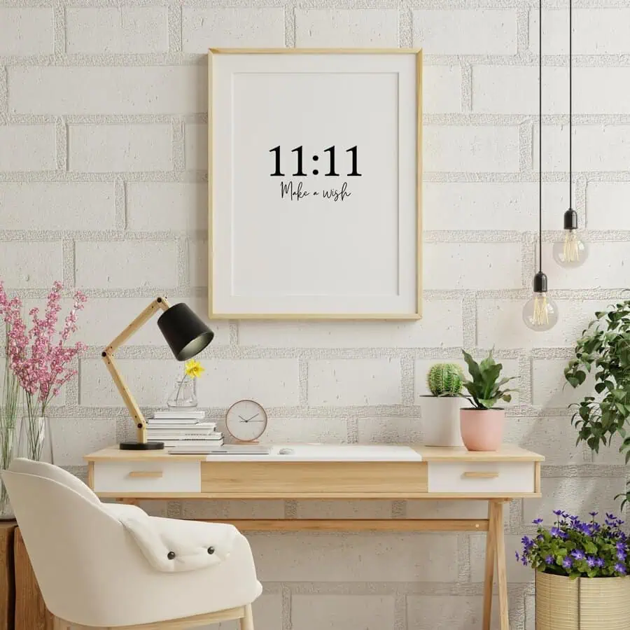 Light, minimalist home office with “11:11 Make a wish” art, wooden desk, and potted plants for a fresh, positive vibe.