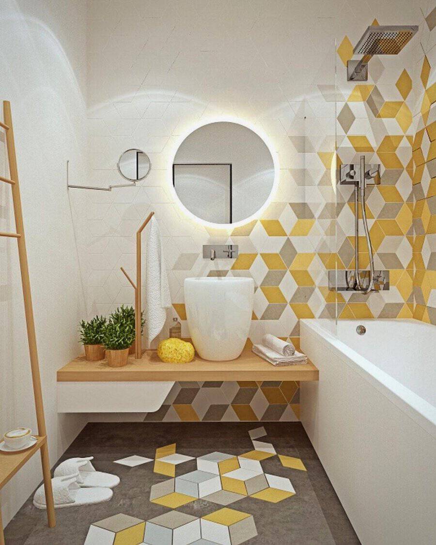 Geometric bathroom with yellow accents, a round mirror, and a minimalist wooden shelf.