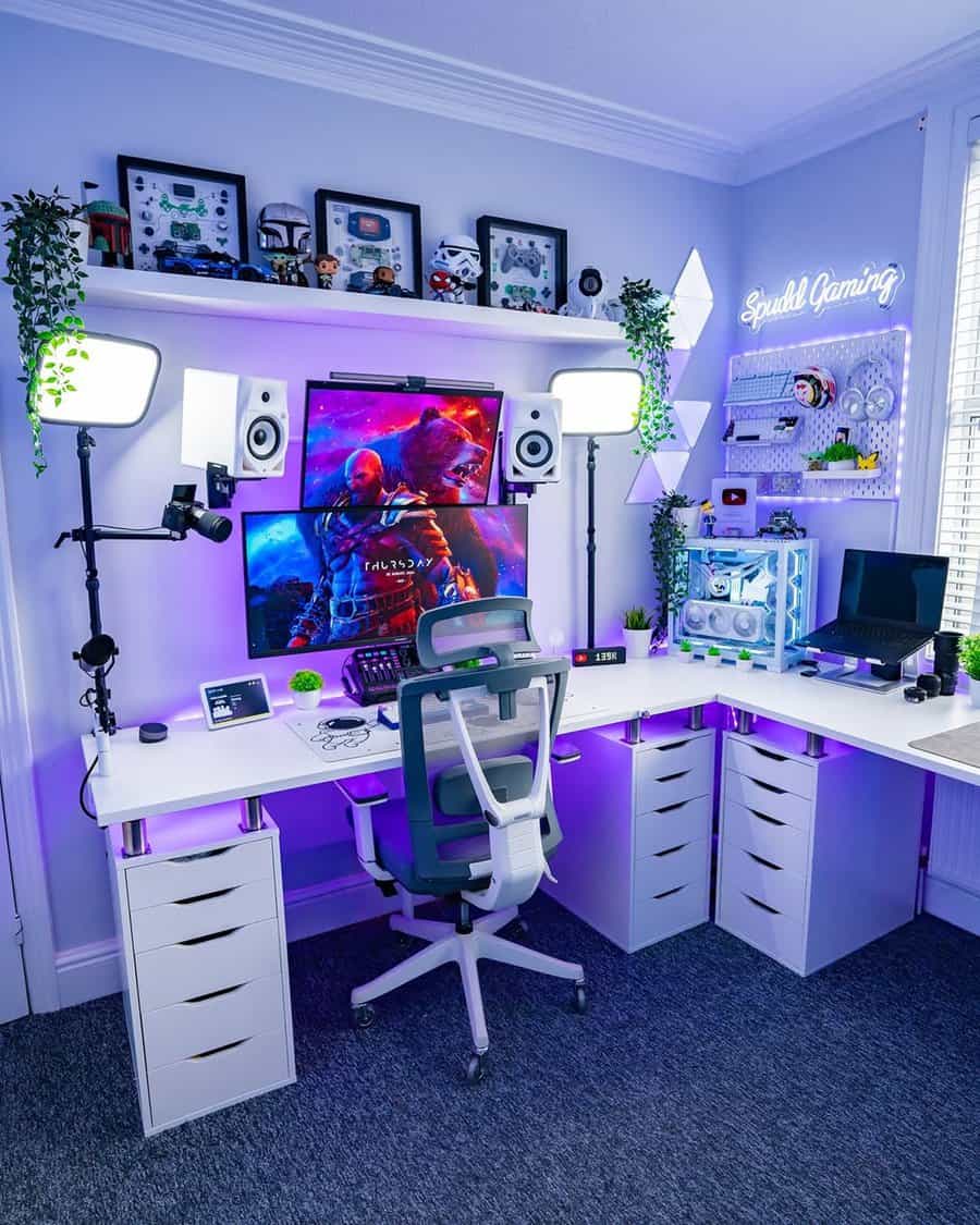 Gaming setup with wraparound desk, purple LED lights, collectibles, and multiple monitors for an immersive home gaming station.