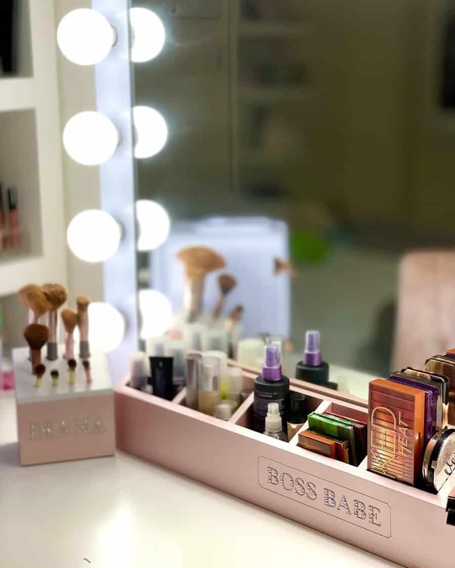 Pink makeup stand with labeled compartments keeps beauty products organized while adding a stylish, feminine touch to a vanity.